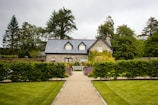 Stone cottage with manicured garden and pathway