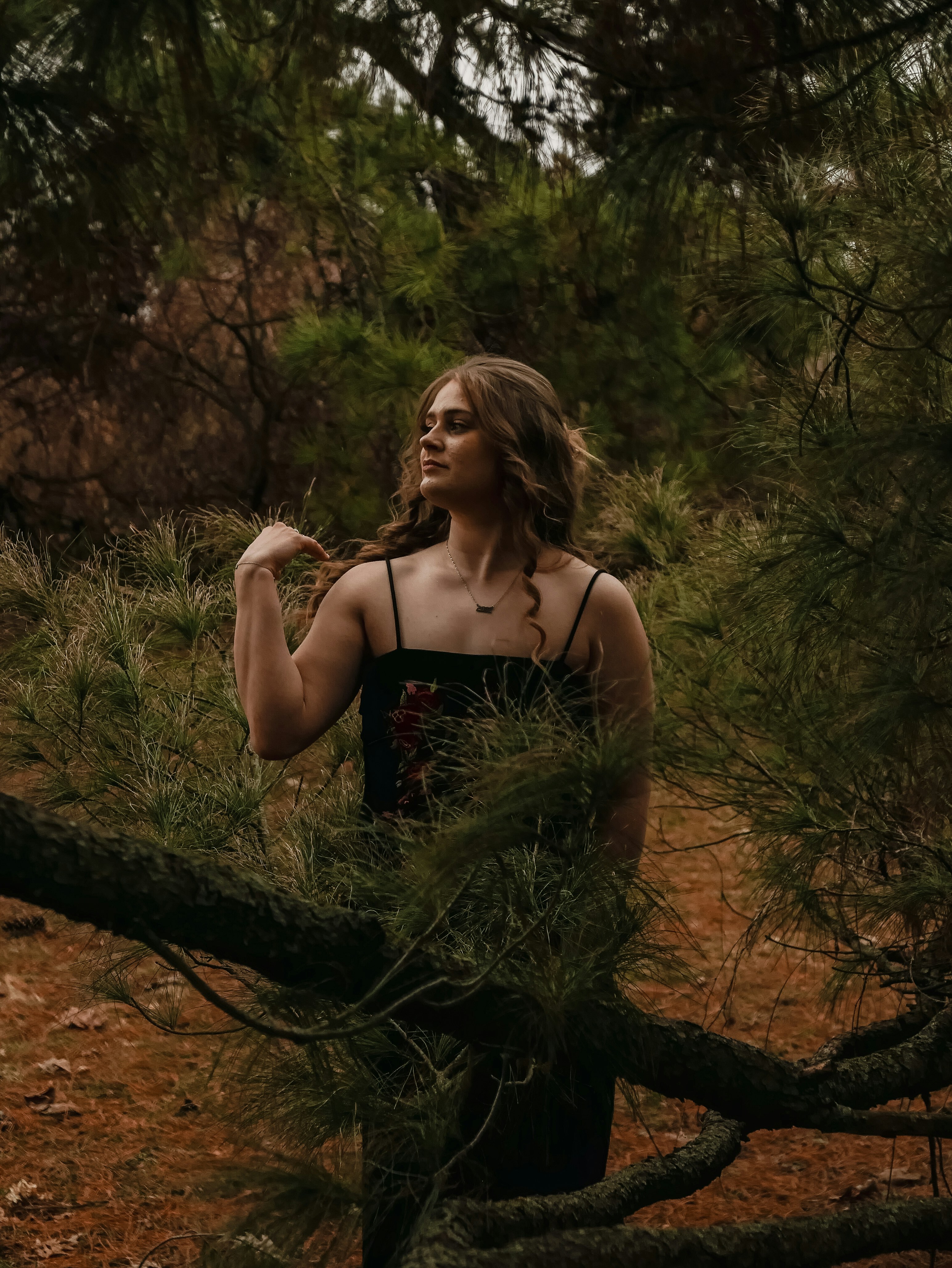Young woman posing in a forest setting