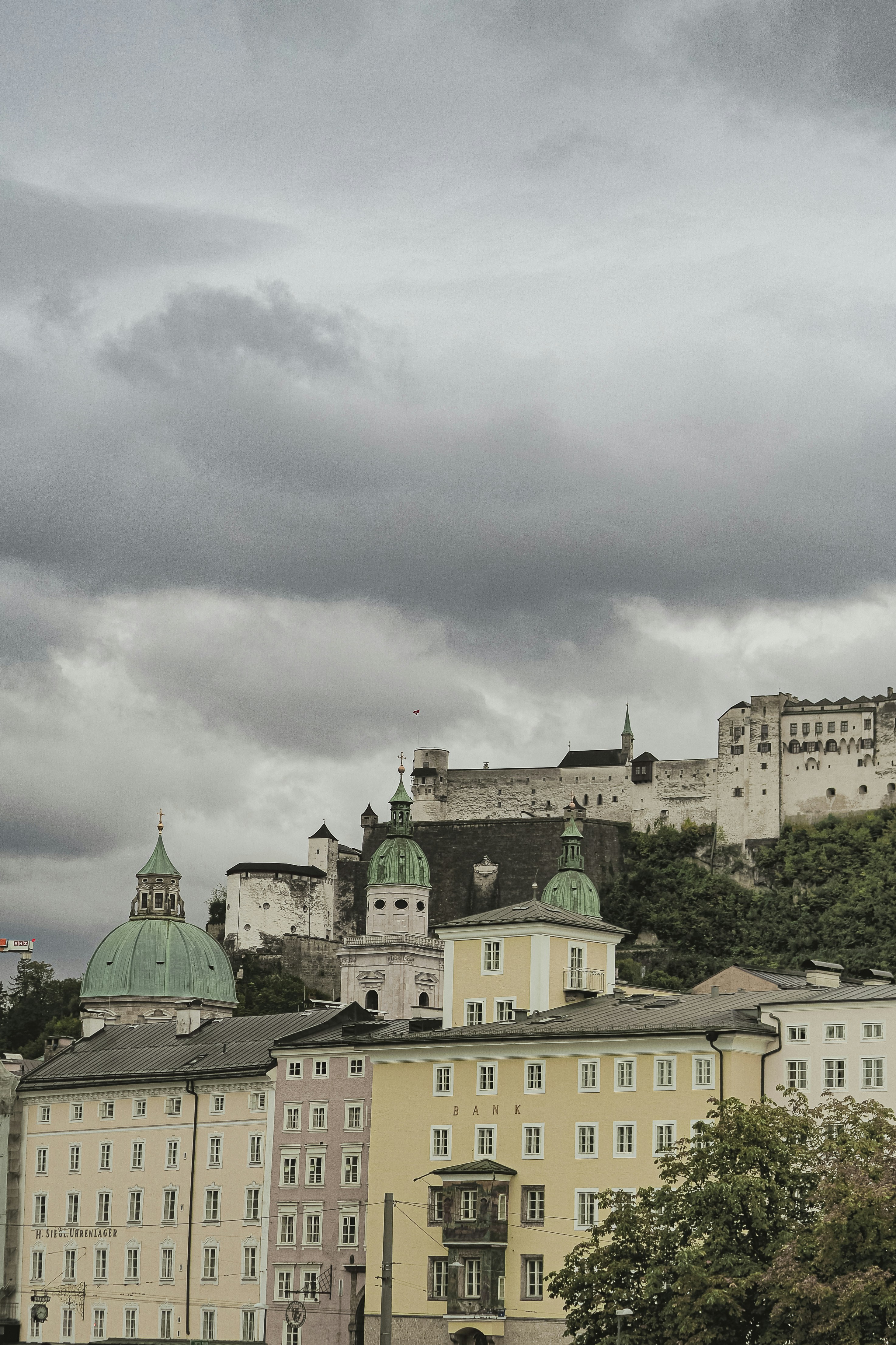 Historic buildings and castle on a cloudy day.