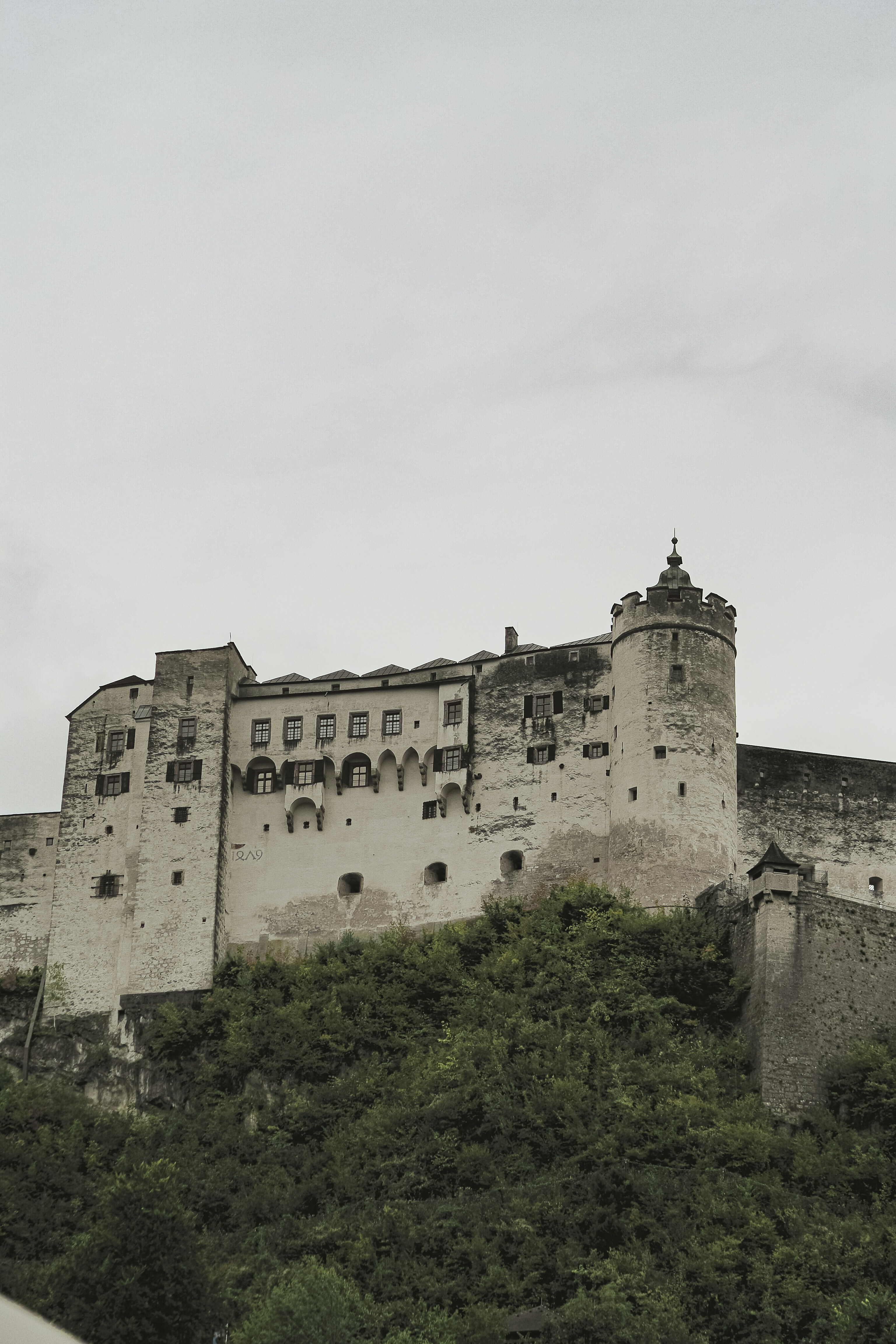 Historic fortress perched on a lush green hill