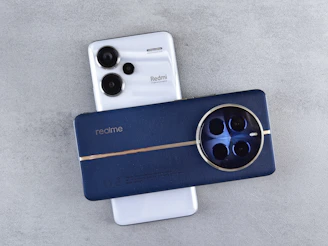 Two smartphones with distinctive camera designs