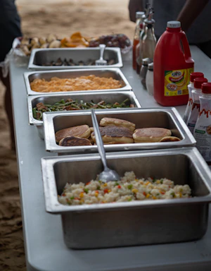Buffet table with various food dishes and condiments