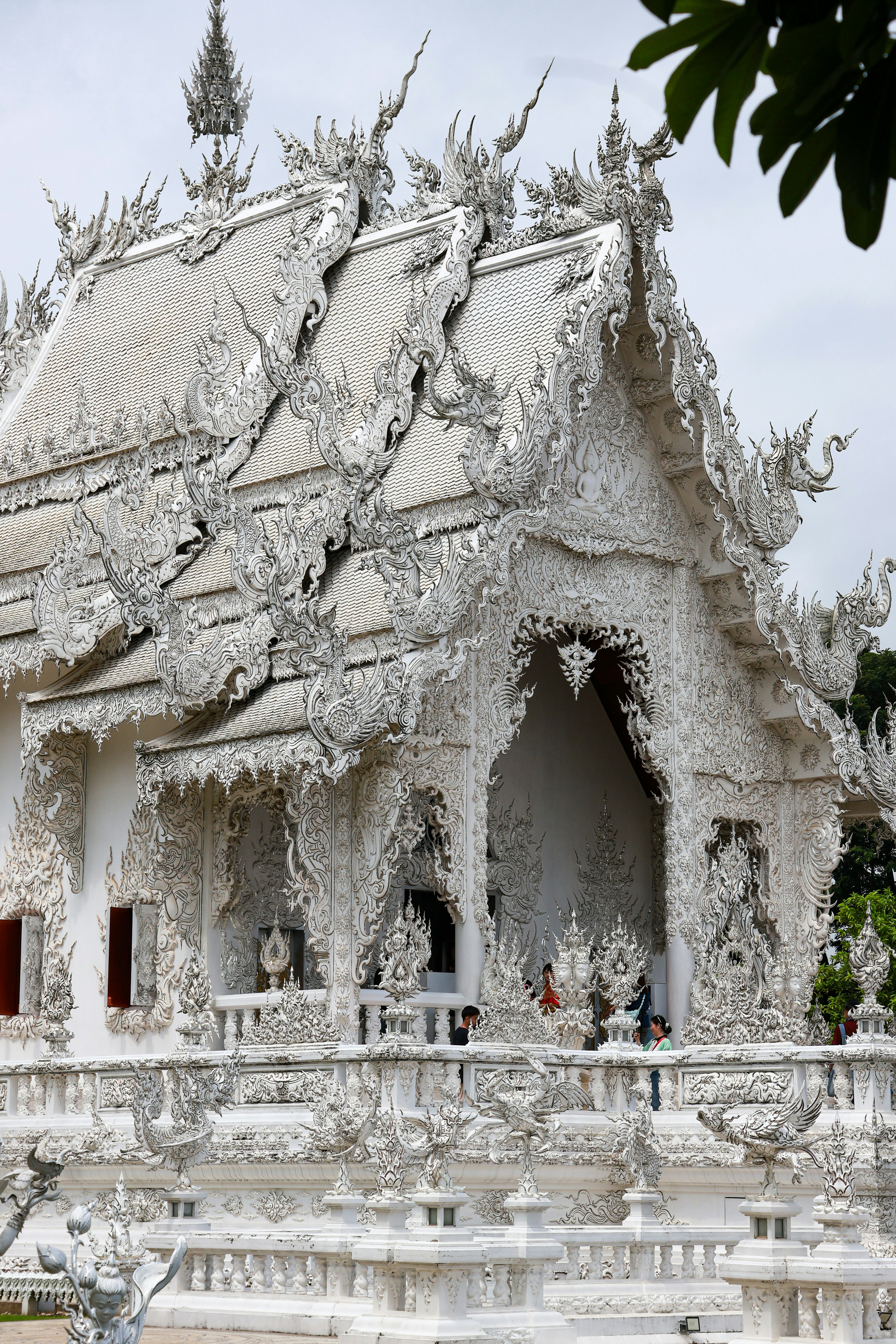 Intricate white temple with ornate details and spires