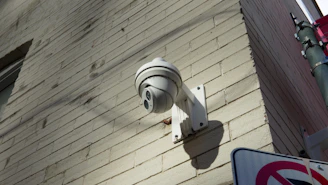 CCTV Security camera mounted on a brick wall