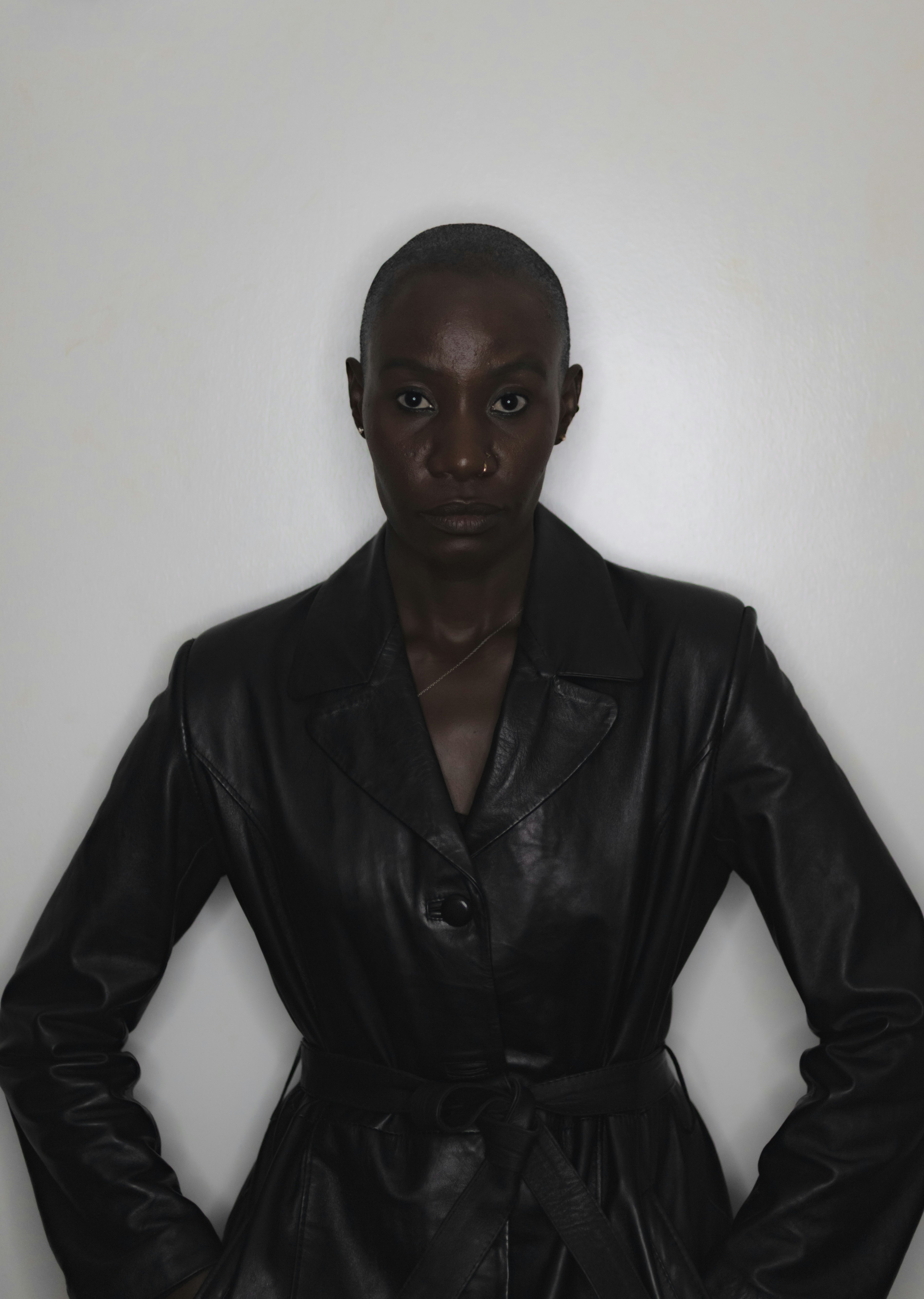 A woman in a black leather coat