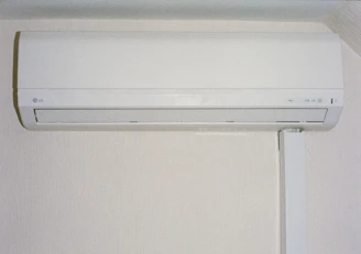 A white air conditioner mounted on a wall.
