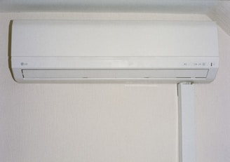 A white air conditioner mounted on a wall.