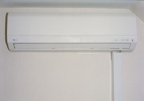 A white air conditioner mounted on a wall.