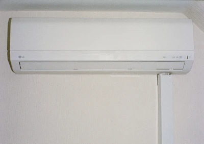 A white air conditioner mounted on a wall.