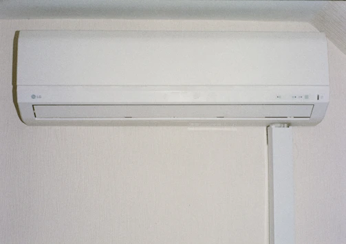 A white air conditioner mounted on a wall.