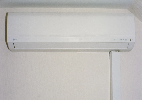 A white air conditioner mounted on a wall.