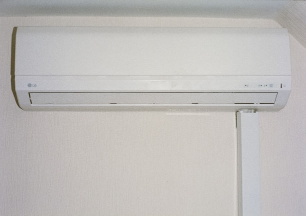A white air conditioner mounted on a wall.