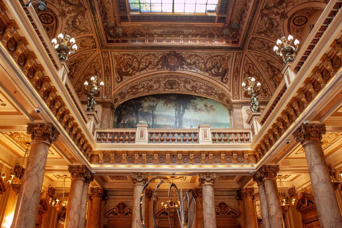Ornate marble lobby with columns inside Flush Fortune Casino Hotel