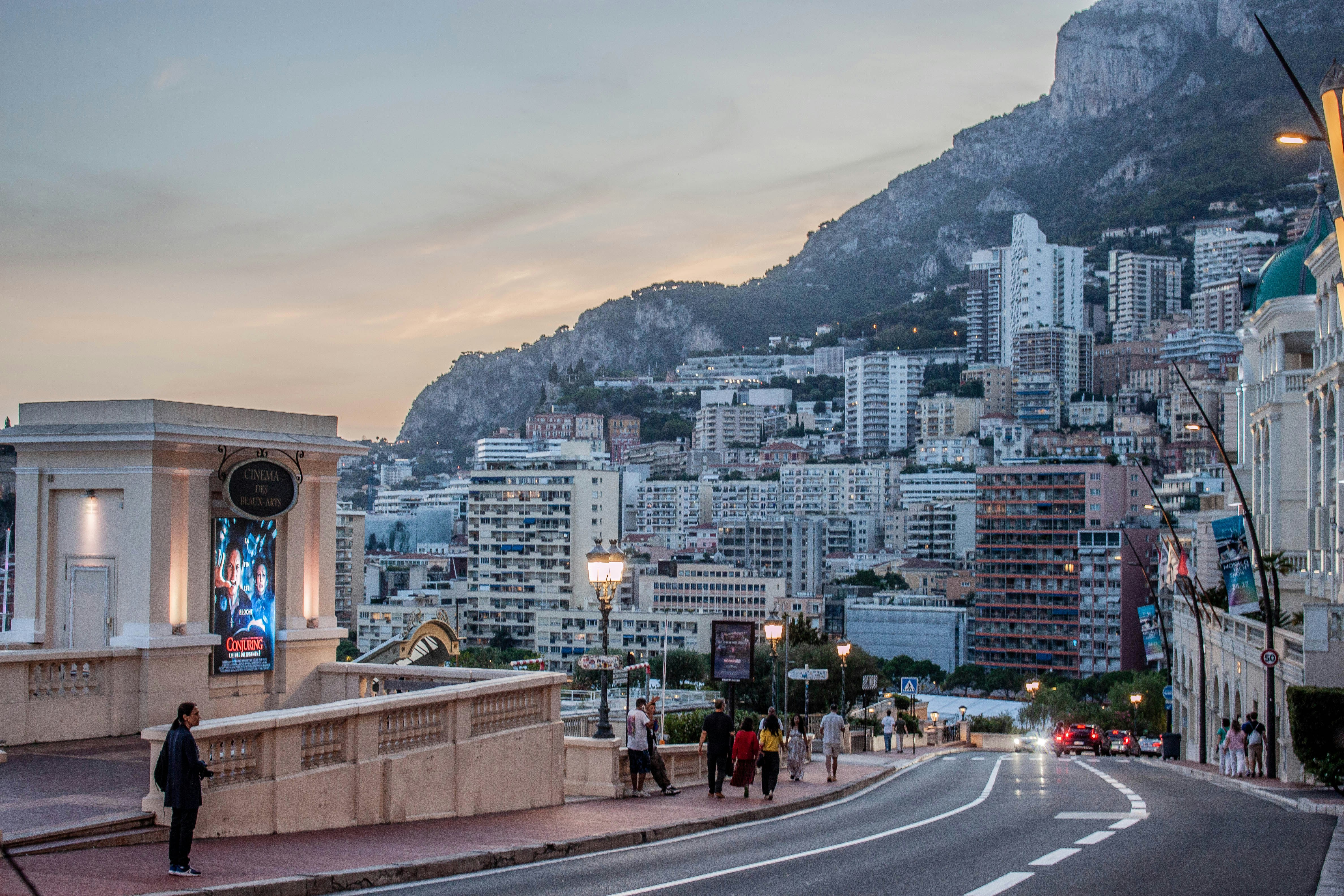 Cityscape with buildings on a hill and a road
