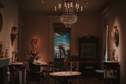 Antique room with chandelier and harp