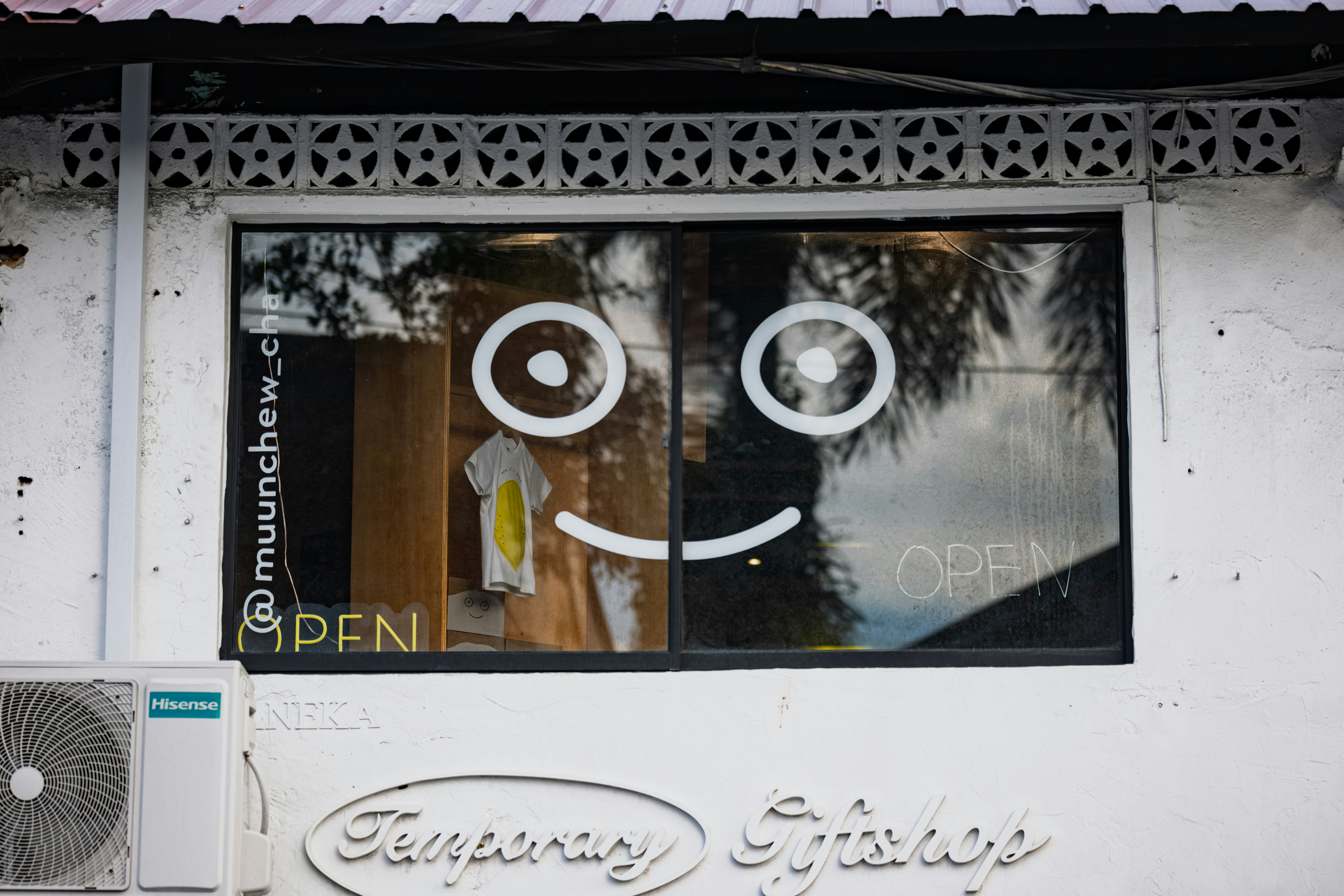 Store window with smiley face