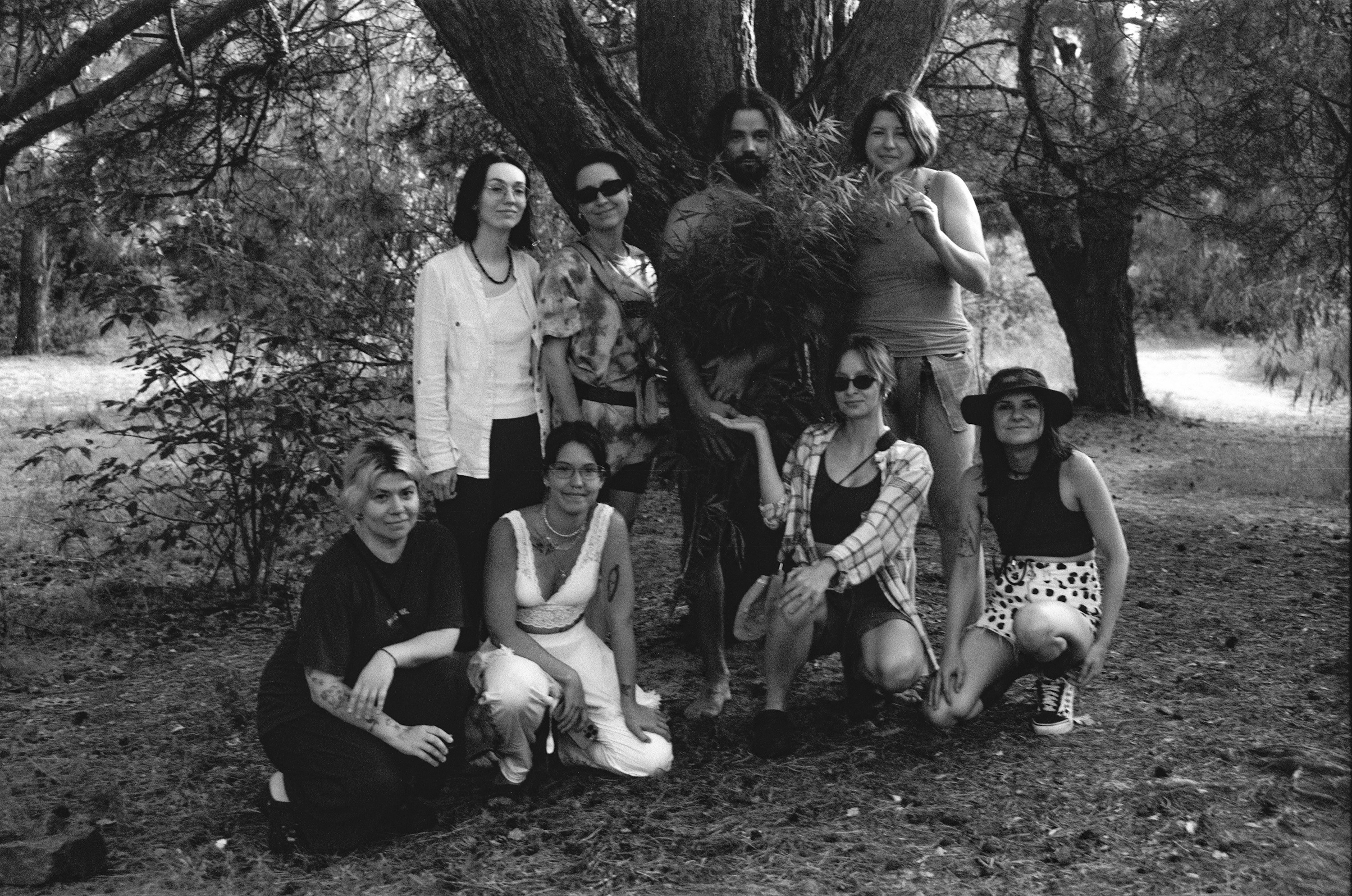 Crew chilling after a nude photoshoot in a forest