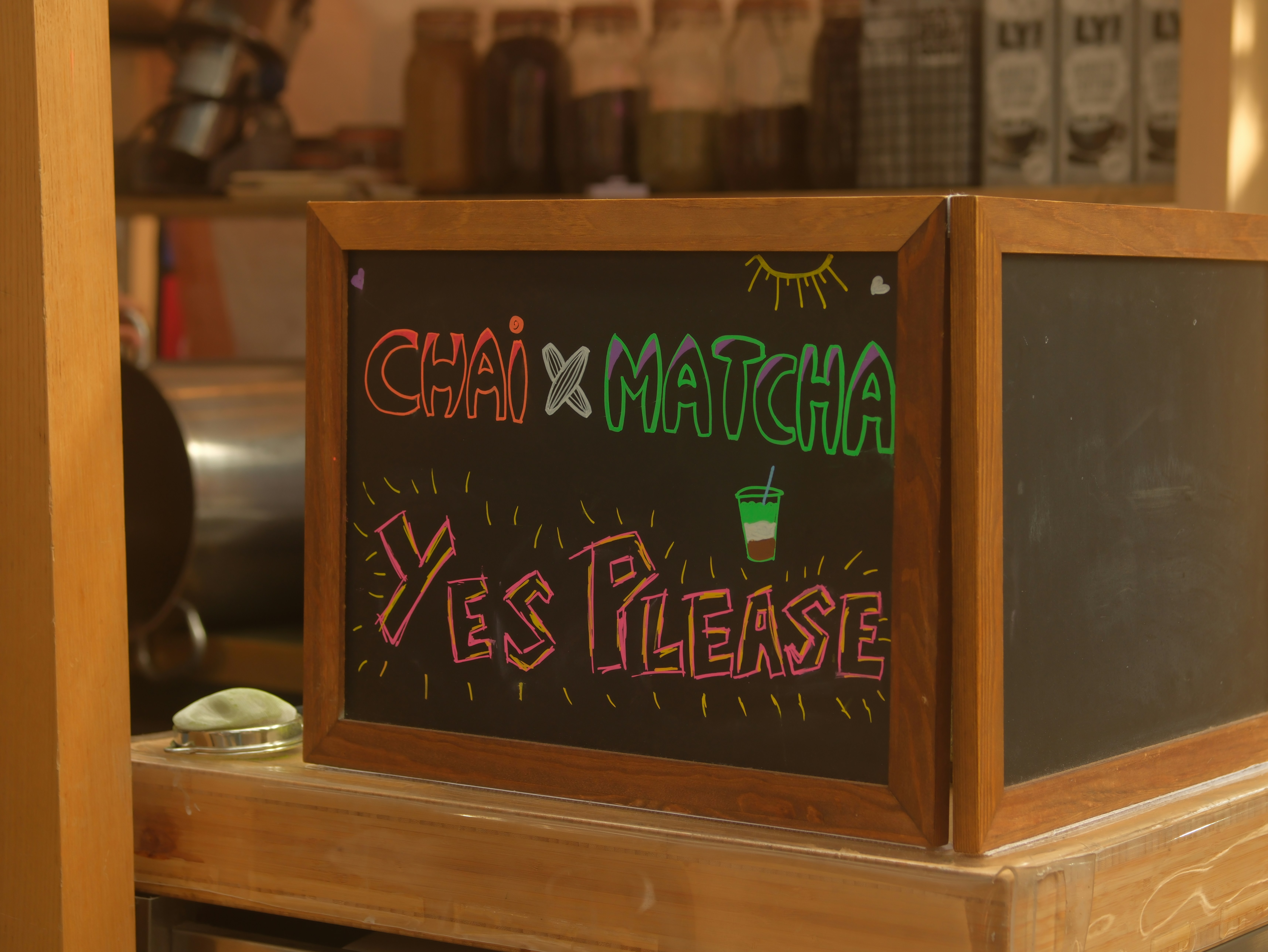 Chai and matcha sign saying yes please