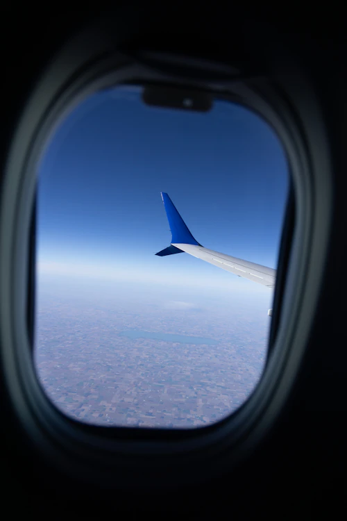 View of the aircraft wing above the clouds