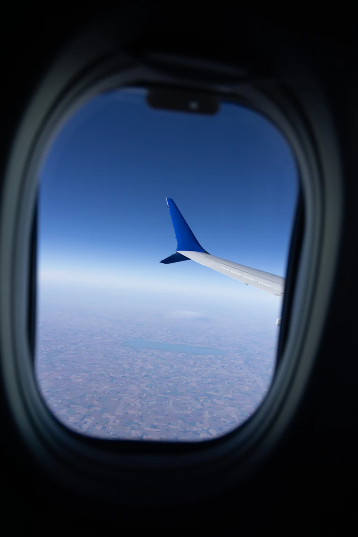 Airplane wing above clouds