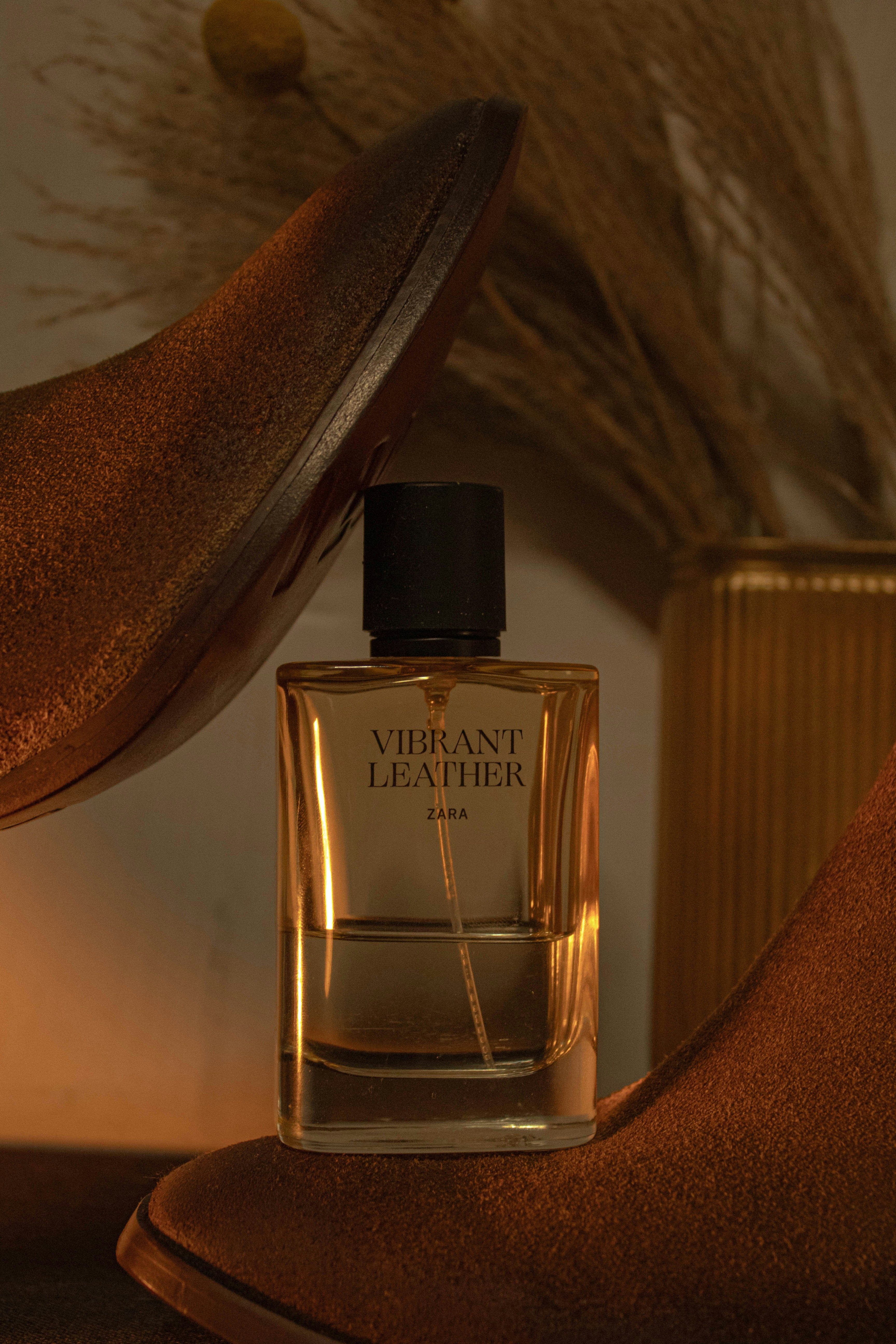 Vibrant leather perfume bottle with brown boots