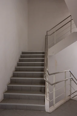 Modern metal staircase handrails by Al Naim Fabrication.