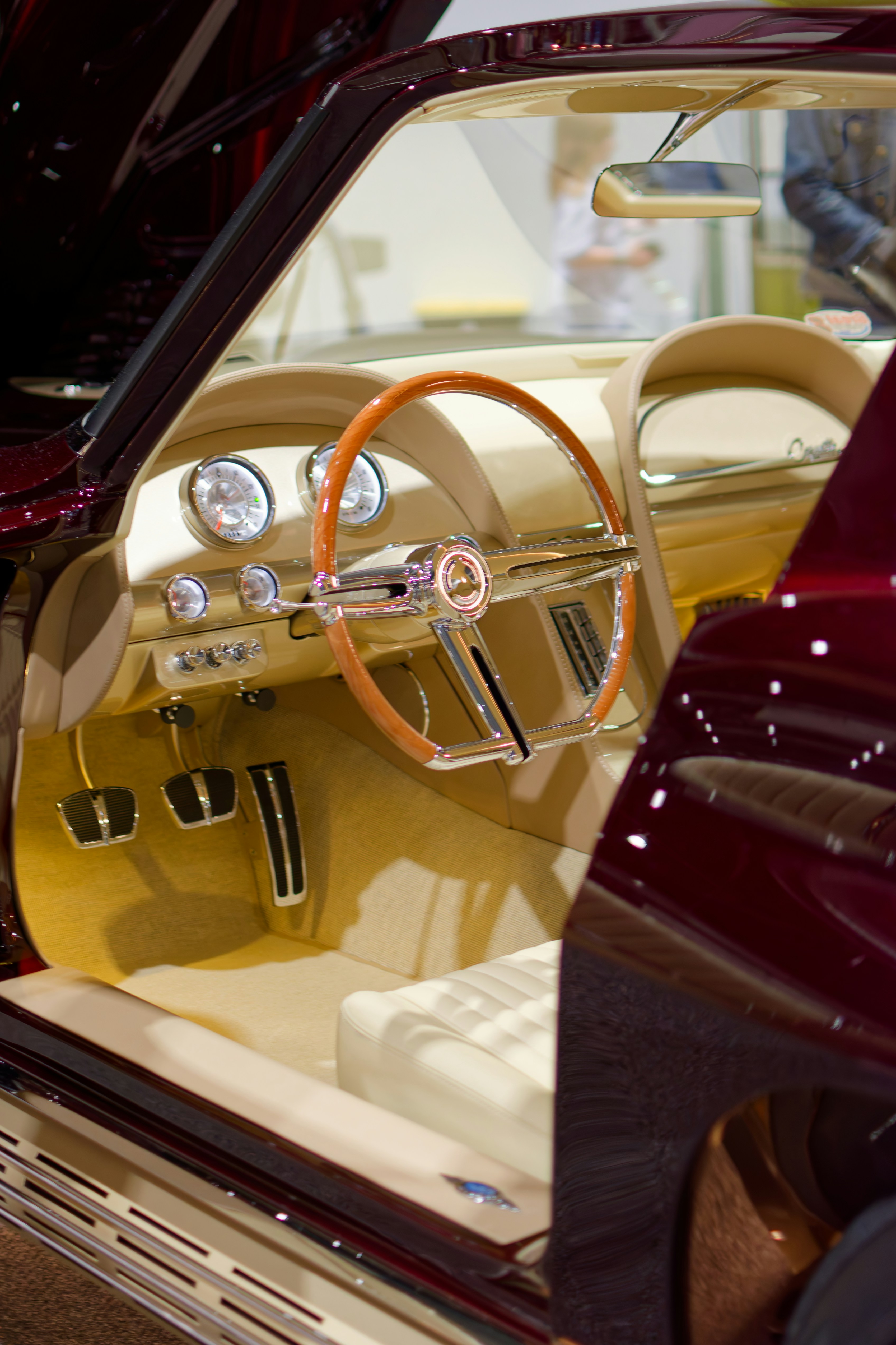 Interior of a classic car with wood steering wheel