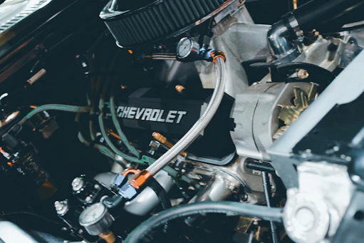 Close-up of a chevrolet engine with many parts.