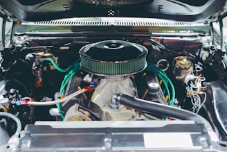 Close-up of a classic car engine with chrome details.