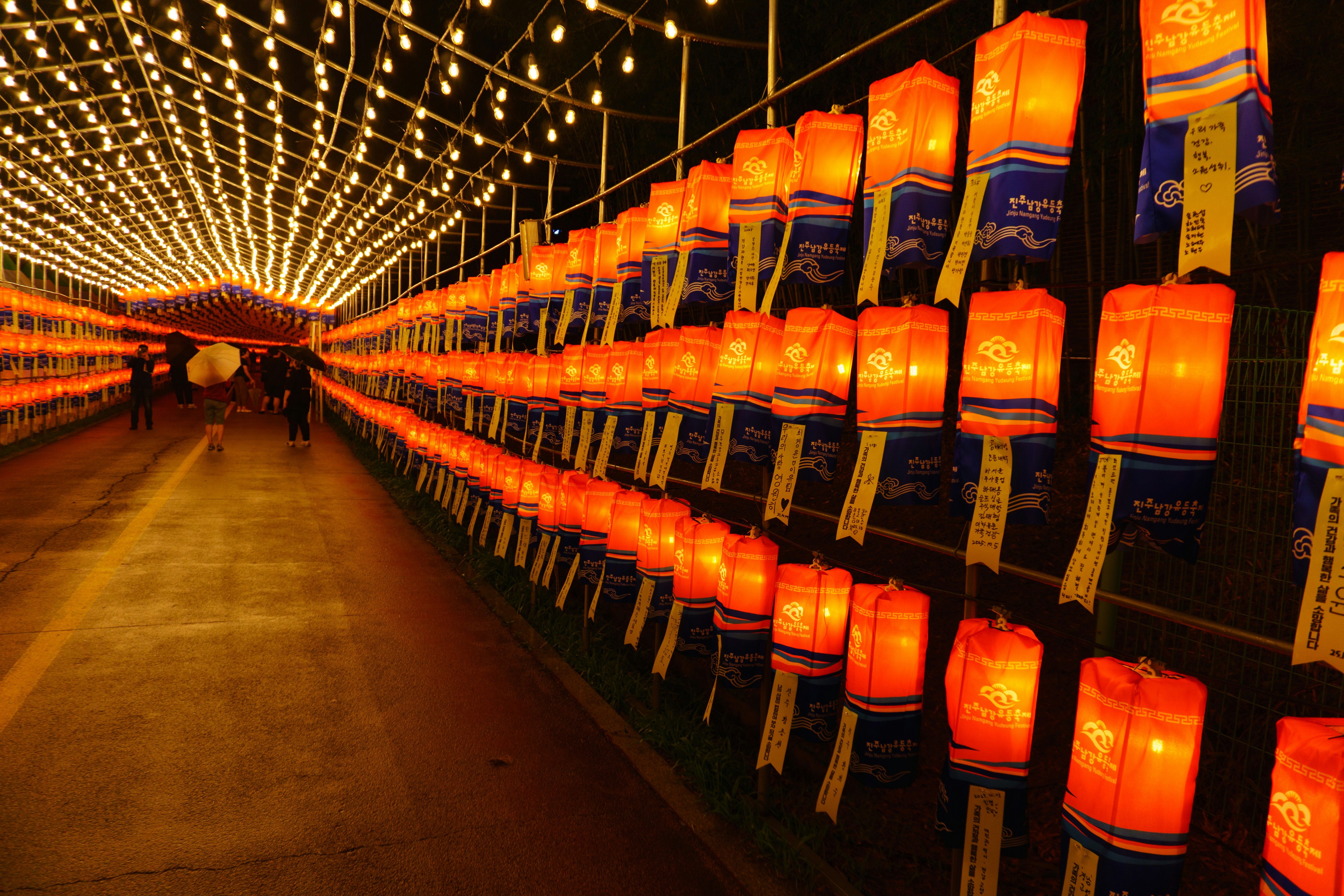 Rows of illuminated orange lanterns at night