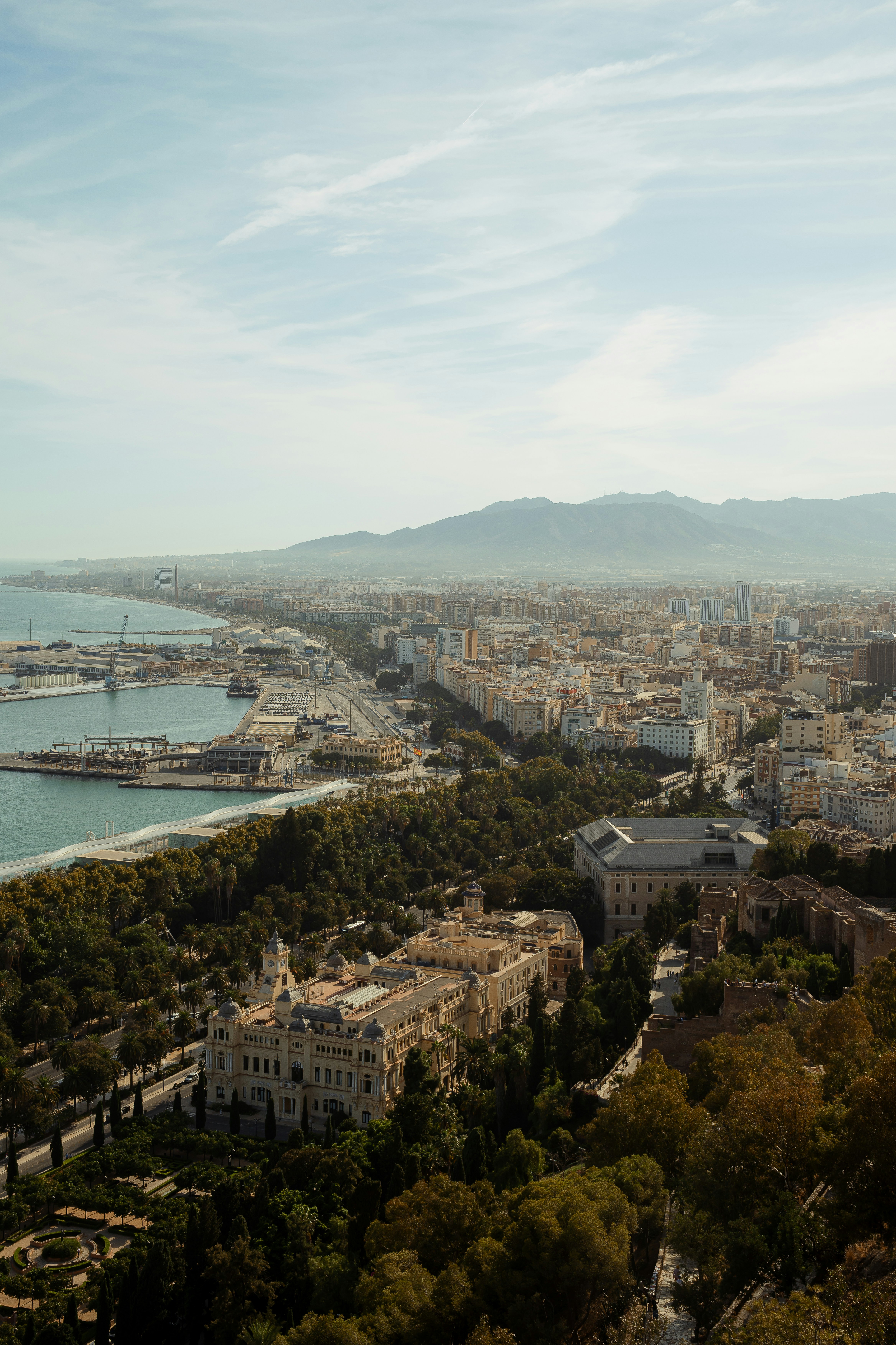 Aerial view of a coastal city with mountains in background