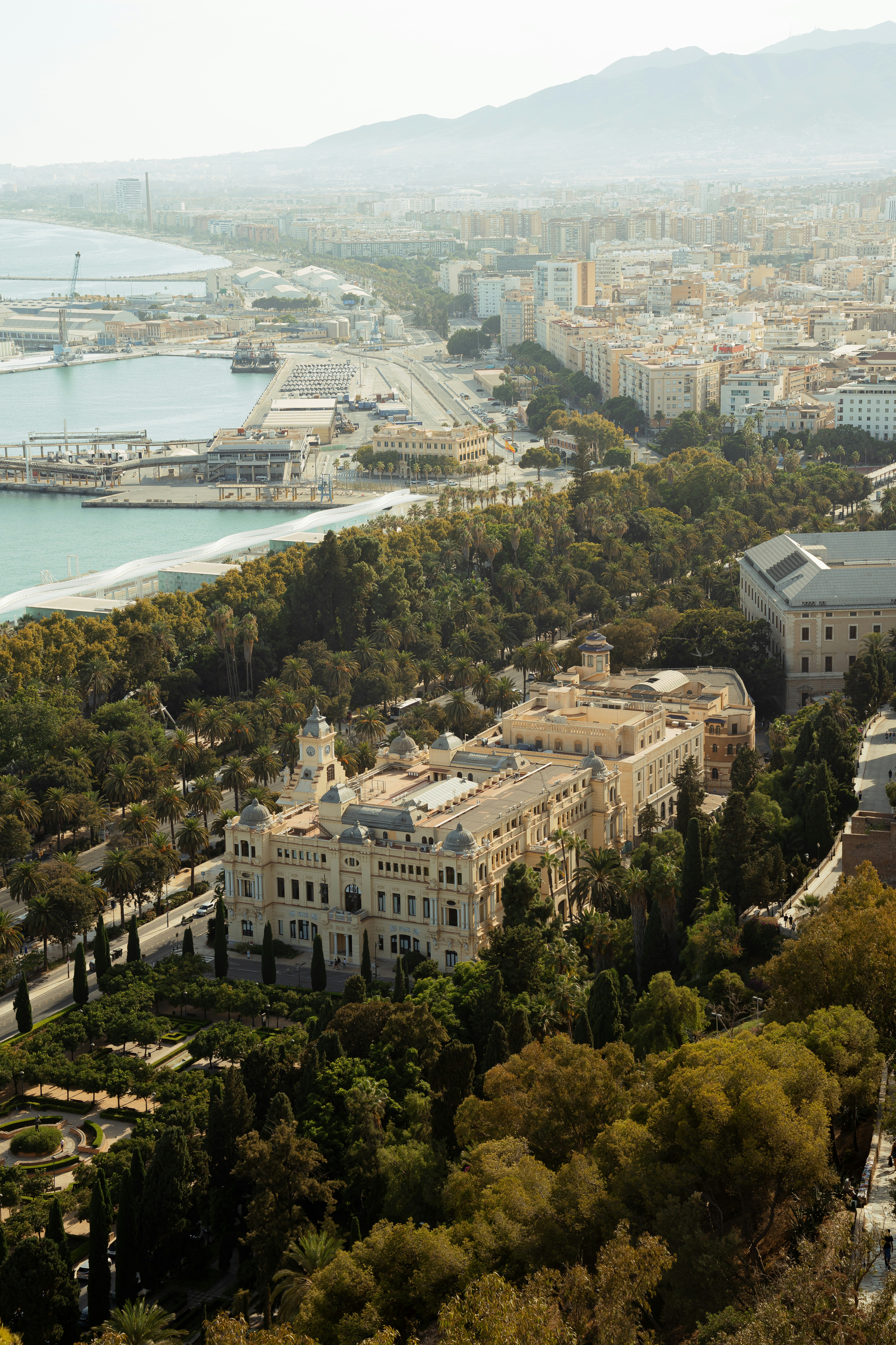 Aerial view of a historic building surrounded by lush greenery
