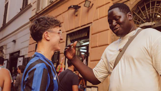 Two men talking on a street