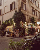 Cozy outdoor cafe decorated with plants and lights