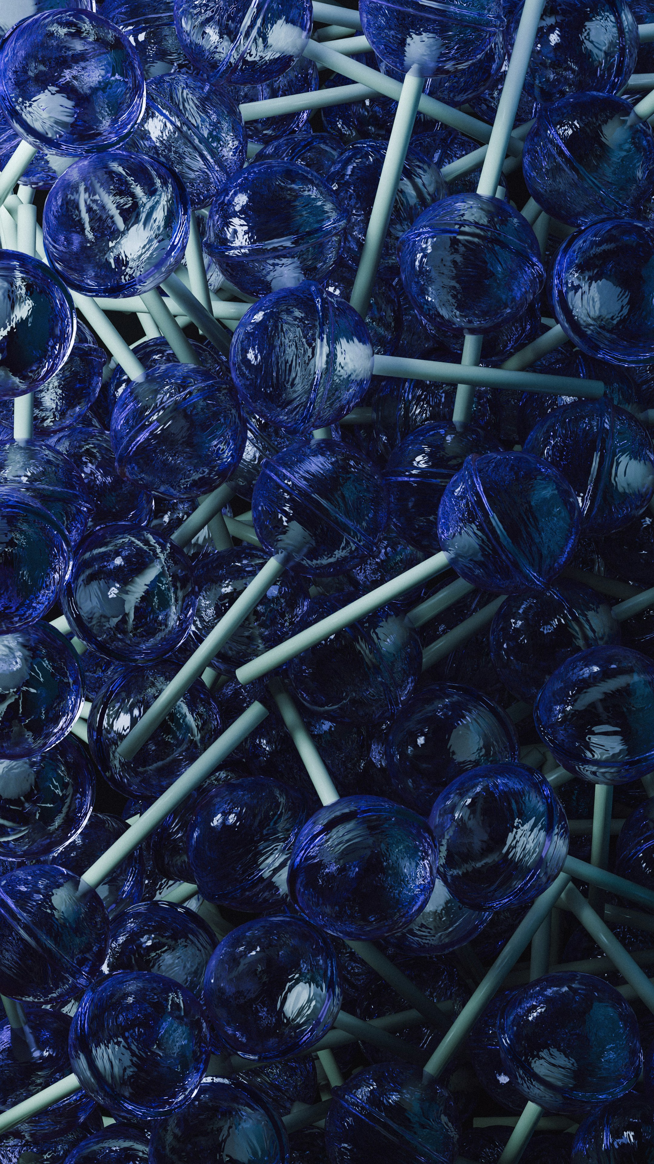 A pile of blue lollipops with white sticks
