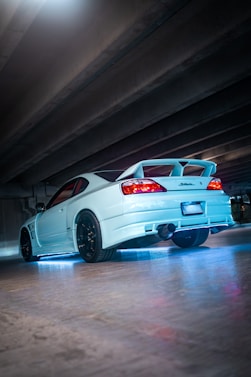 White sports car with blue underglow lights