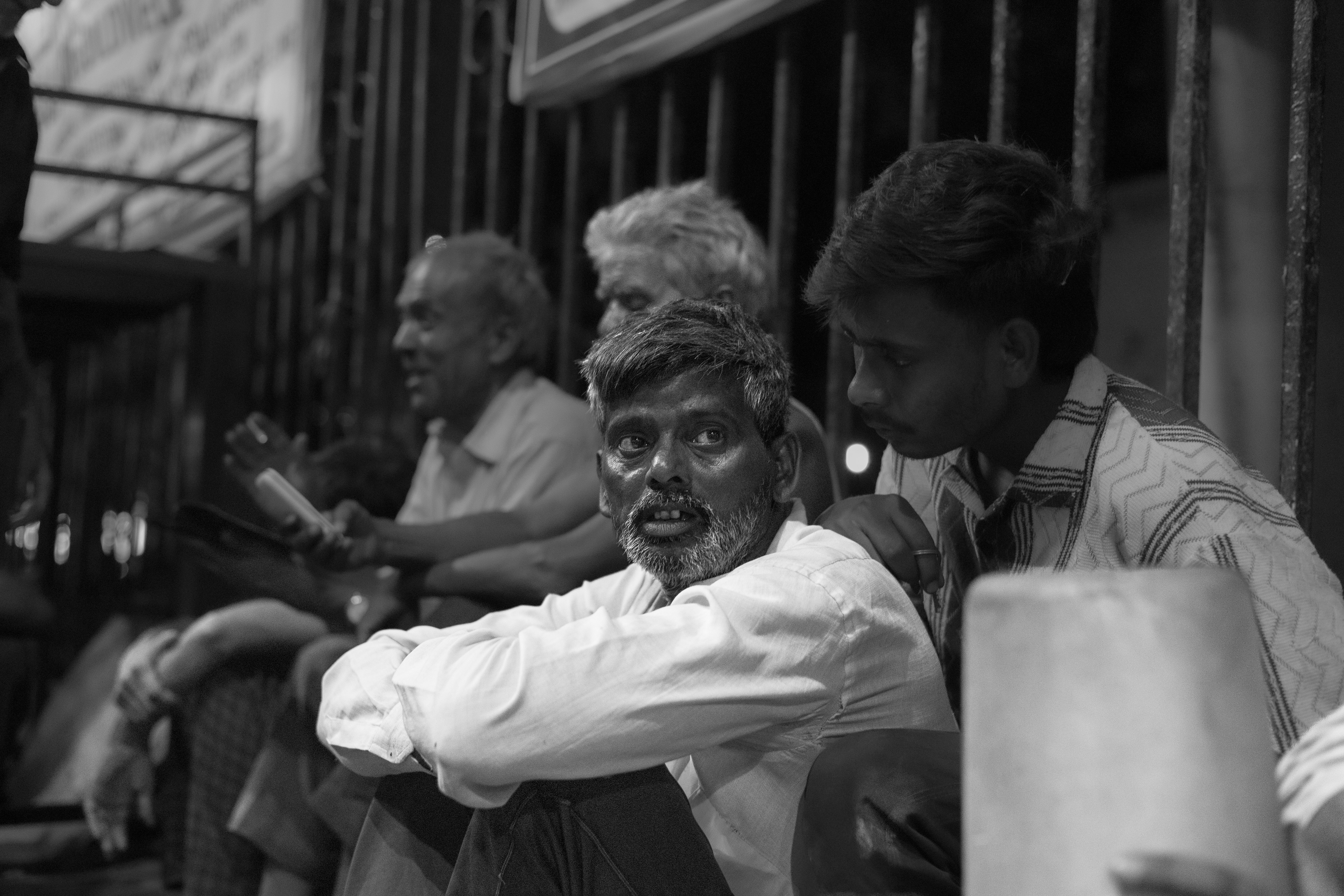Men sitting together outdoors