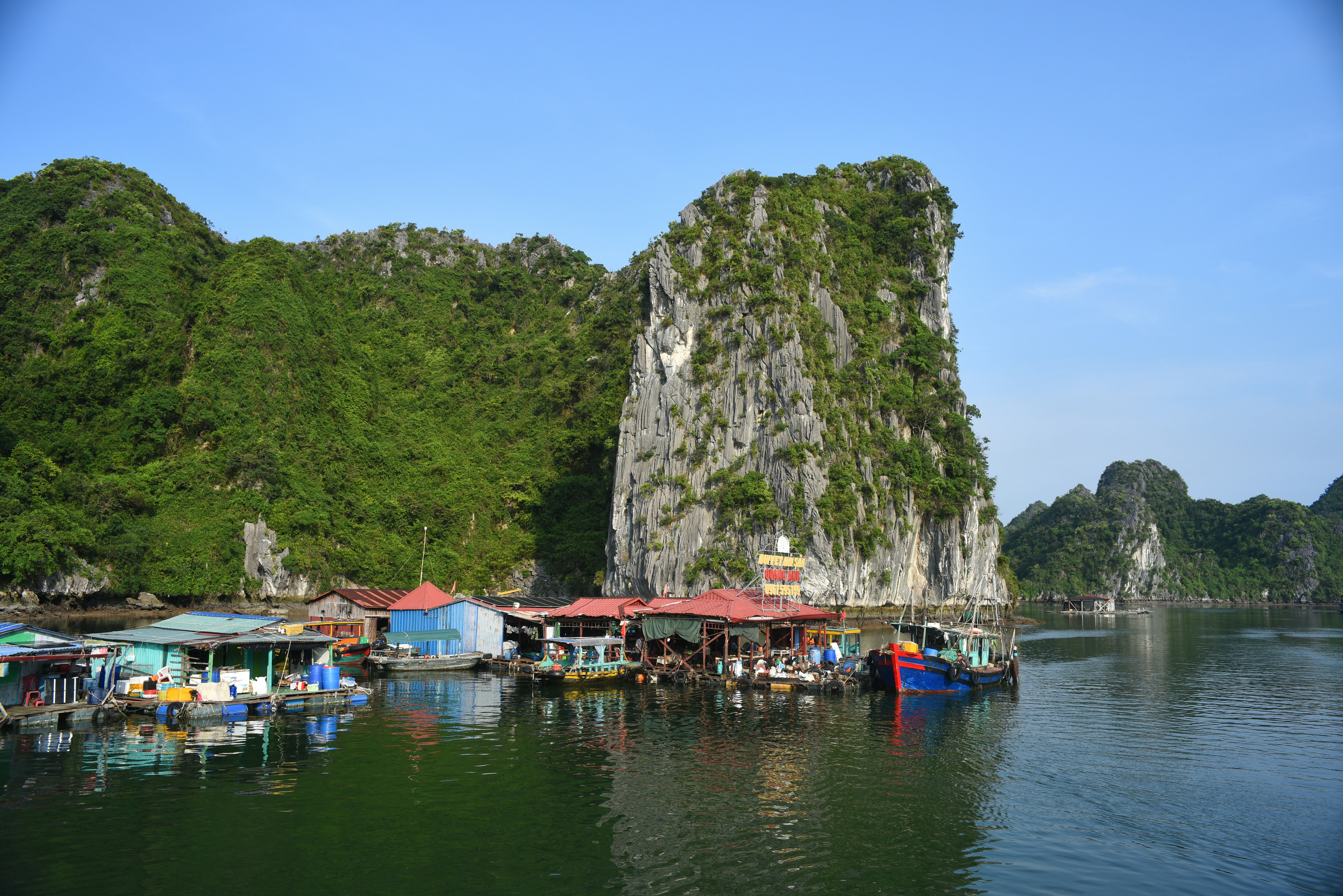 Floating village nestled among limestone karsts