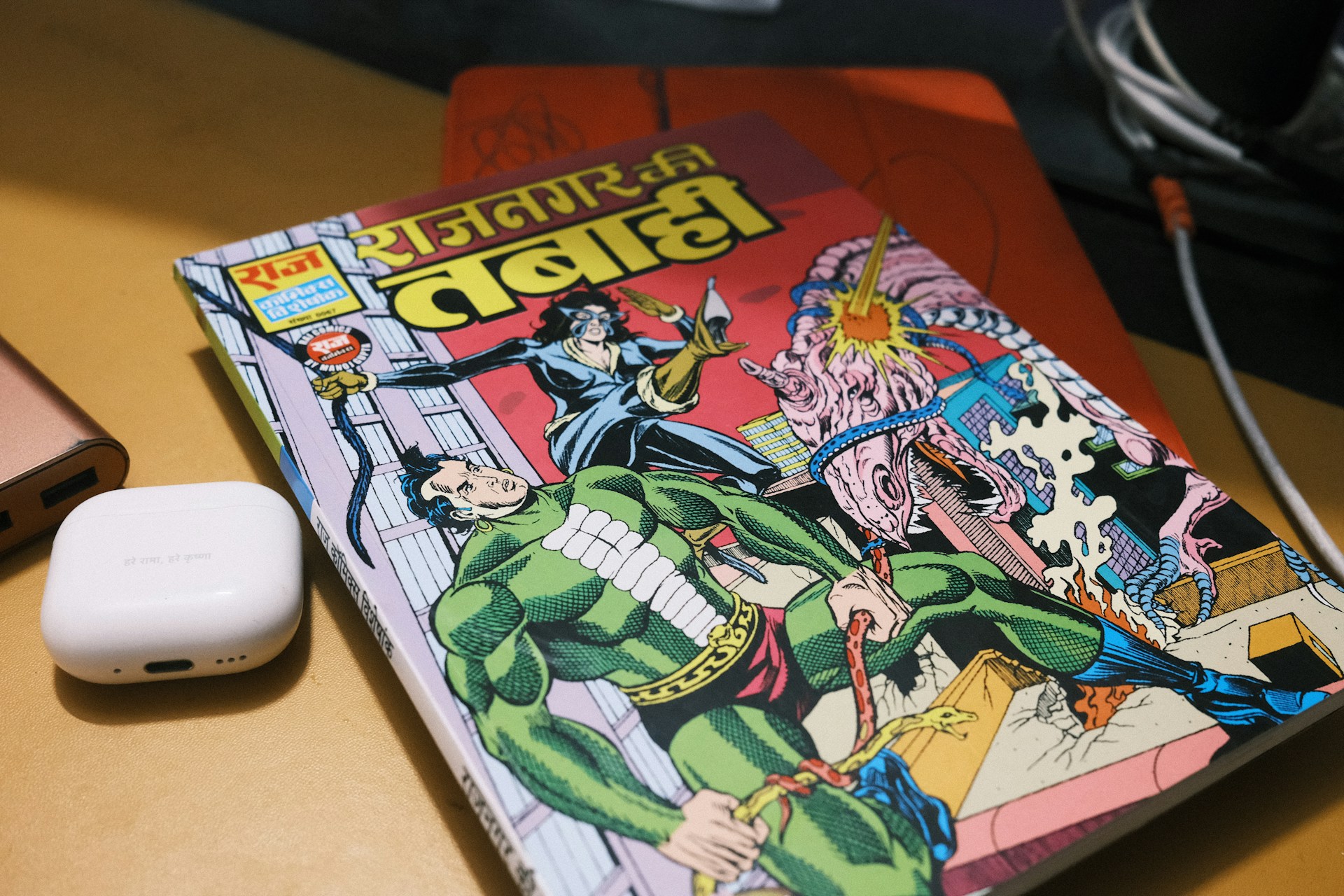 Comic book with colorful superhero illustrations on desk