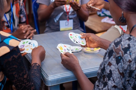 People playing a card game around a table