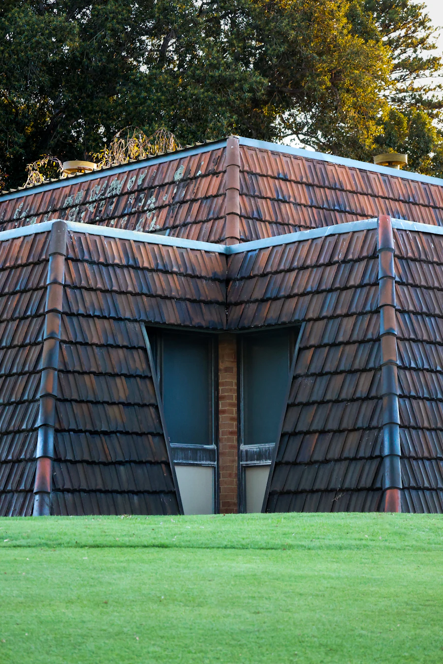 Australian tiled roof under a stormy sky