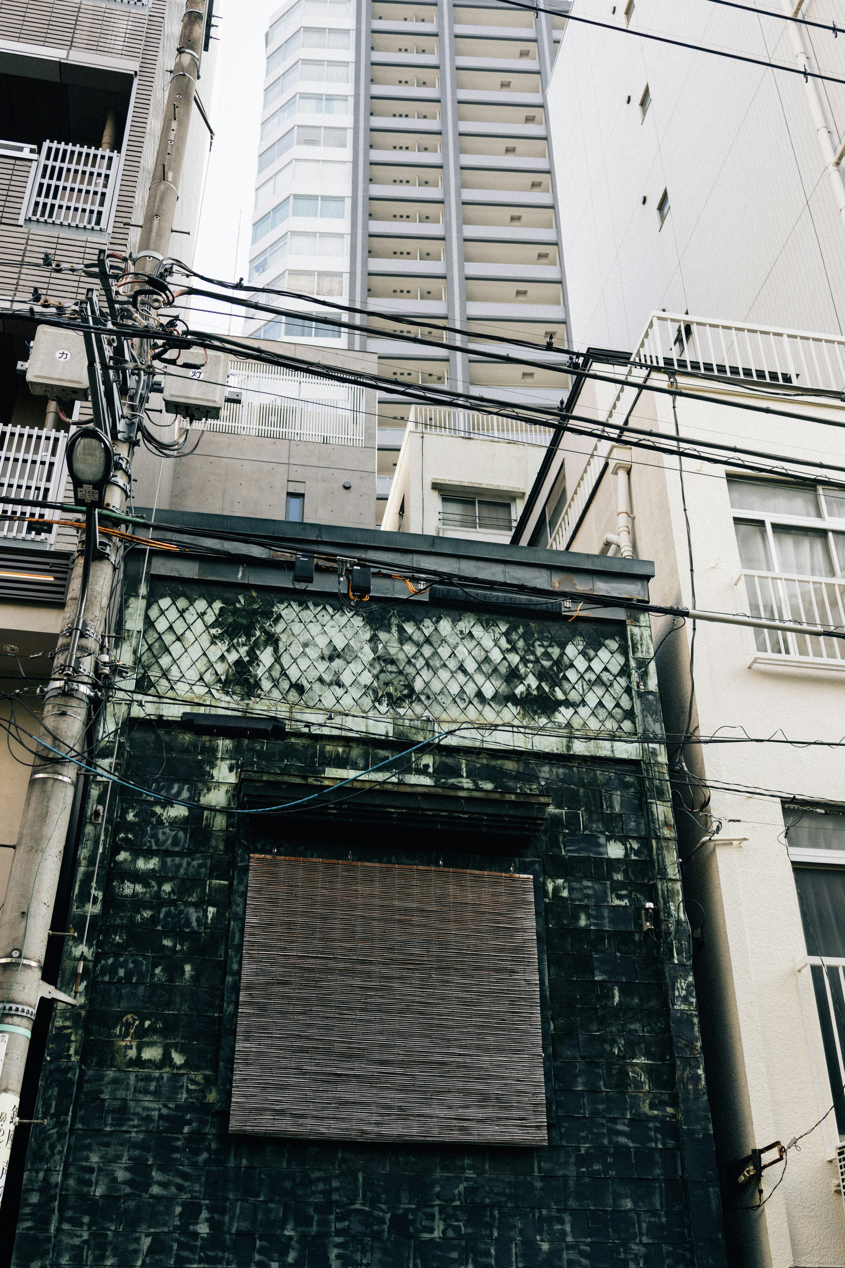 Old building facade with modern skyscraper behind