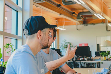 Two men working together in an office.