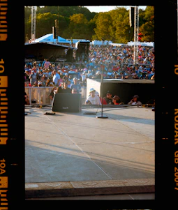Crowd gathered at an outdoor concert stage