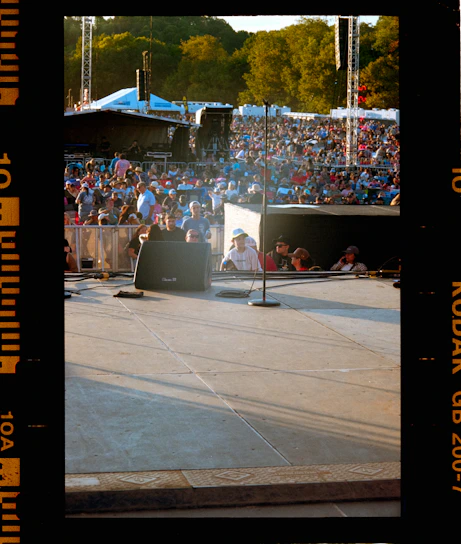 Crowd gathered at an outdoor concert stage