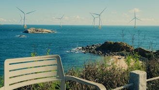 Offshore wind turbines in the blue ocean.