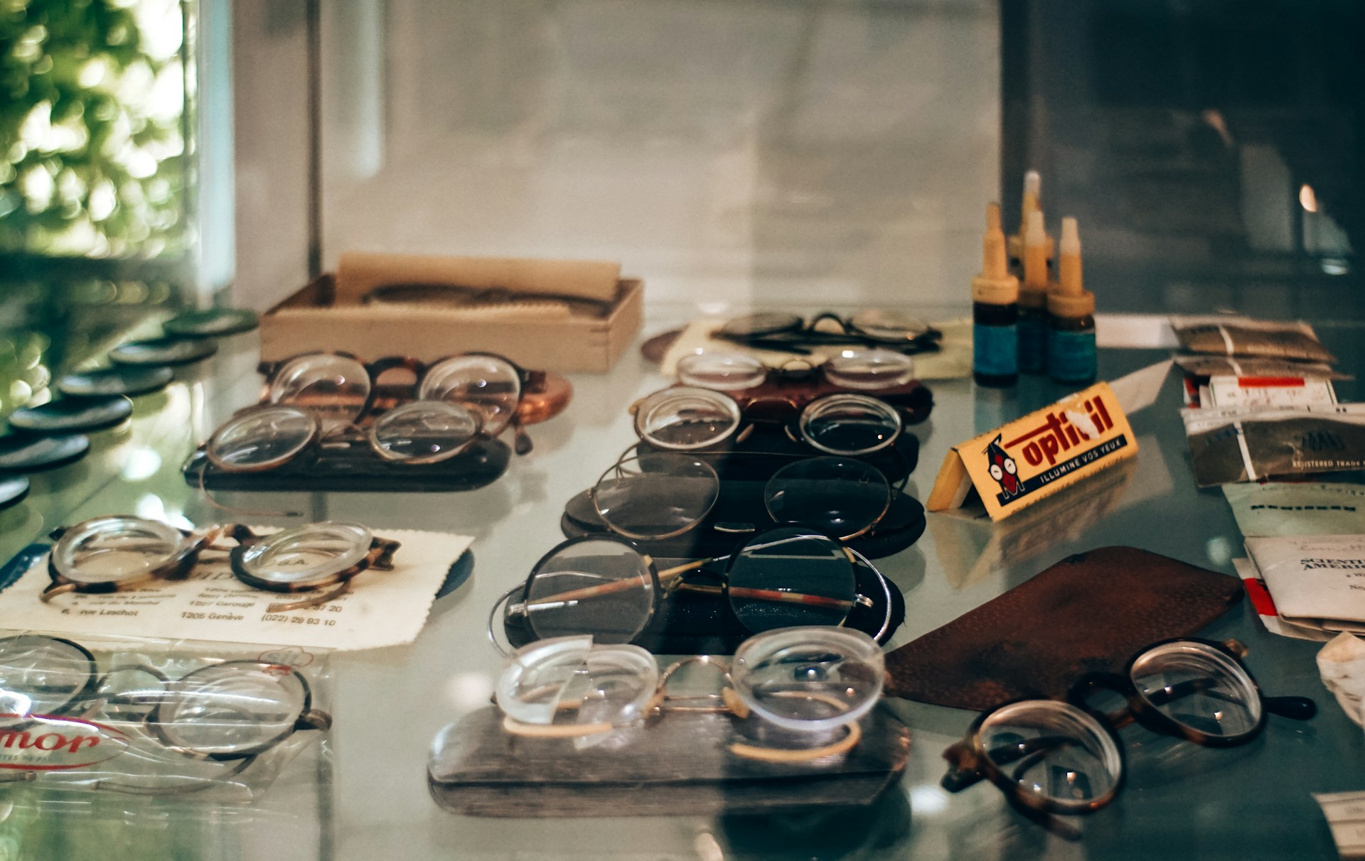 Assortment of vintage eyeglasses displayed in a shop.