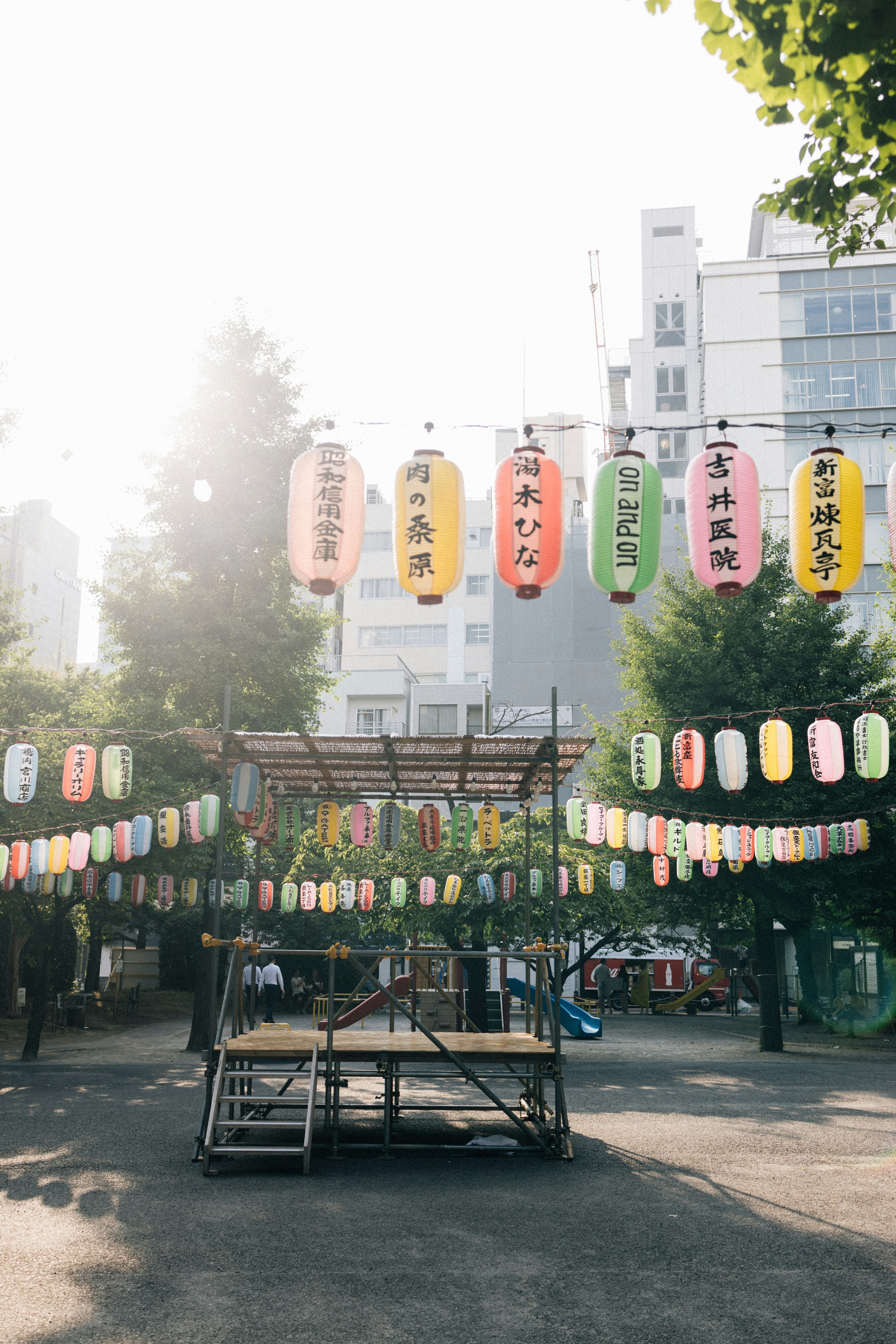 Japanese lanterns strung across an outdoor festival area