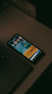 Smartphone displaying instagram feed on desk