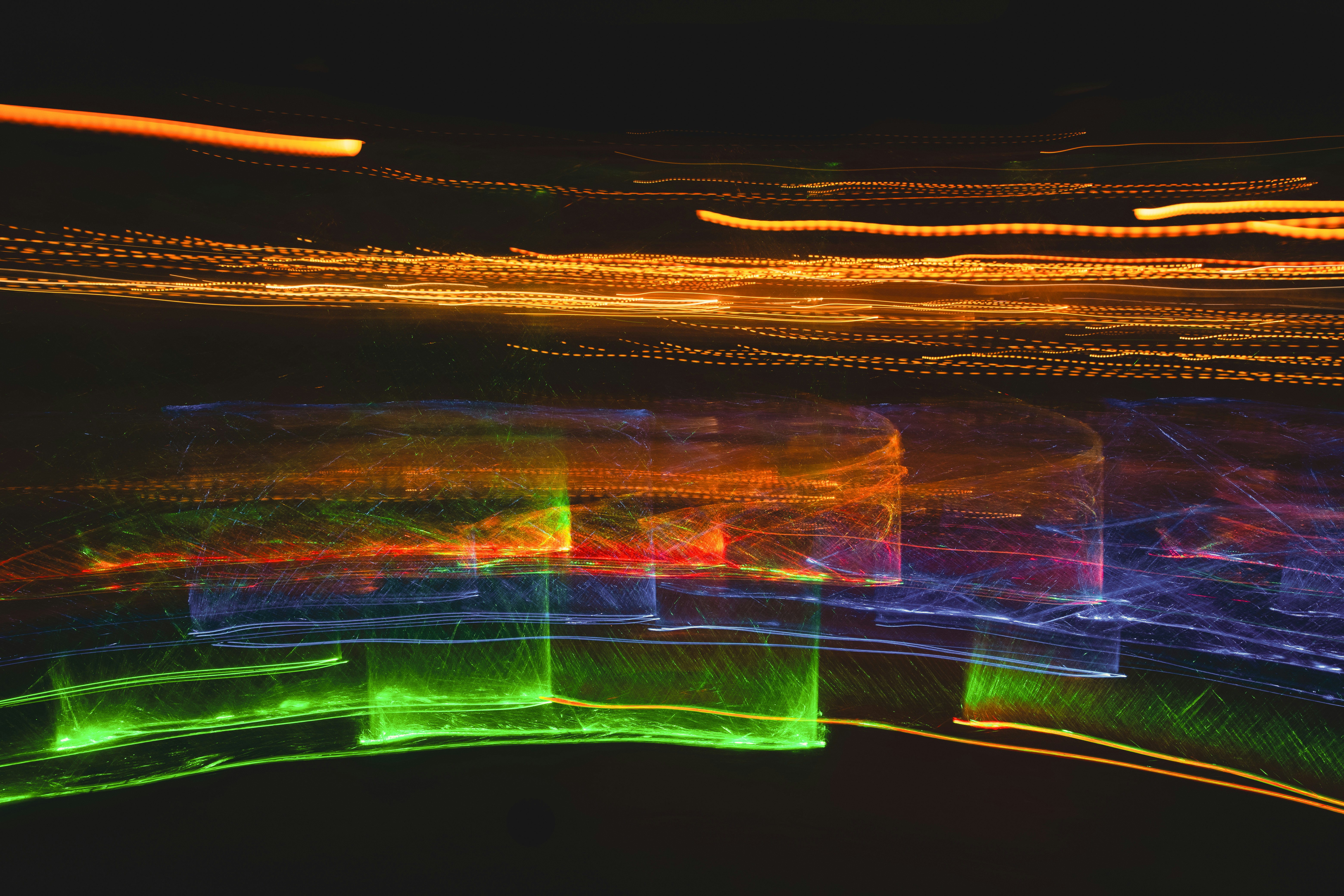 Vibrant colorful light streaks on black